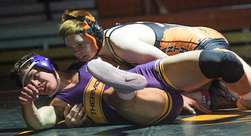 Jeremy Harms holds down Jessen Basse during their bout at 145 pounds on Tuesday. The Panthers won the dual 58-24 and host Lander on Friday at 8 p.m.