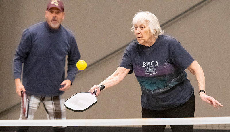 Don Hardy (left) and Sandy Thiel team up for a game of doubles pickleball at Heart Mountain Hall in February. Thiel has been an avid pickleball player and advocate for the sport in Powell.