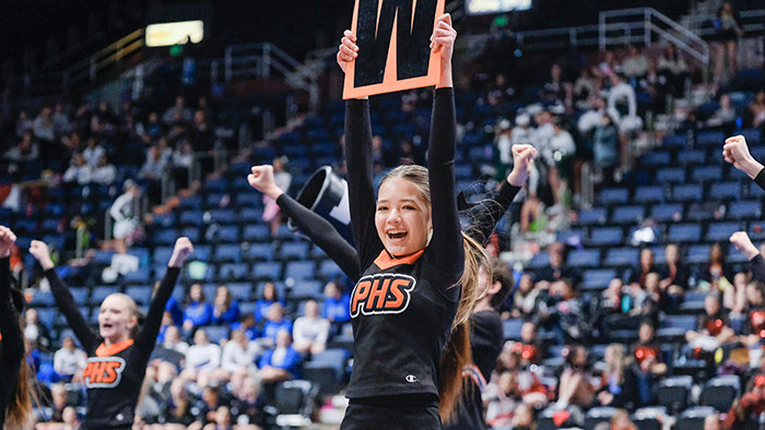 Maddie Johnson holds up the W for the Panthers during Powell’s state spirit game day routine on Wednesday in Casper.