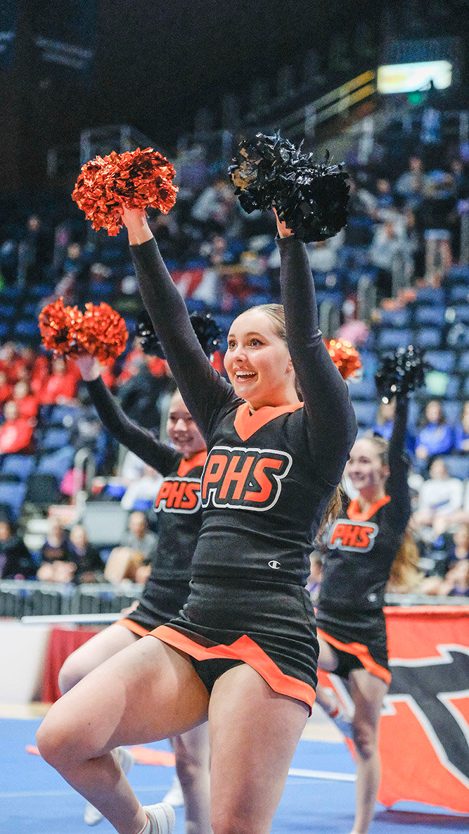 Bella Bertagnole helps lead at the front of the team during the Panther cheer team’s state routine.
