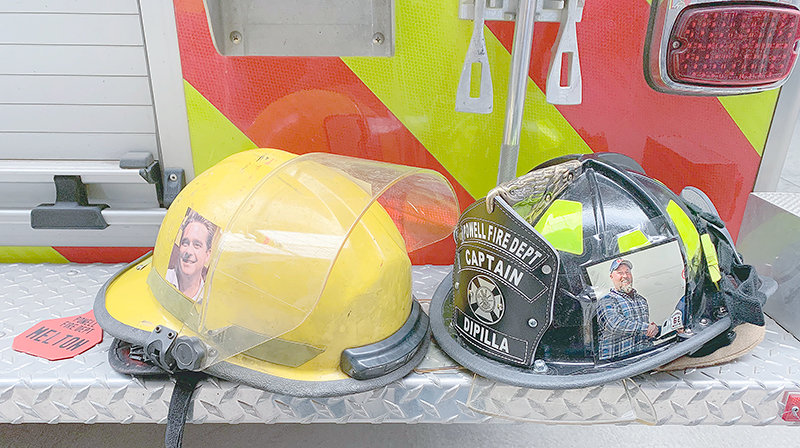 Powell resident Jeremy Johnston and Mike Creamer, a family member of Powell Volunteer Fire Department captain Pete DiPilla, are honored on the helmets of volunteers who traveled to Seattle for the 2023 Lymphoma and Leukemia Society Stair Climb Challenge earlier this month.