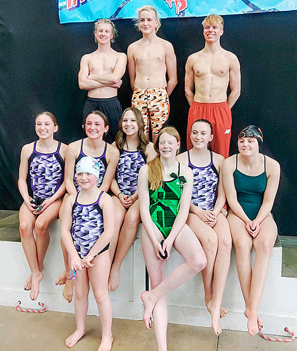 The Piranhas pose on the podium at the winter championships in Laramie. Back row from left: Kobus Diver, Trystan Preator and Nathan Dupont. Middle row from left: Karee Cooley, Kinley Cooley, Kaylen Greenwald, Patricia Christensen and Kaitlin Diver. Front row from left: Danaya Preator and Charlee Brence. Rui Parker is not pictured.