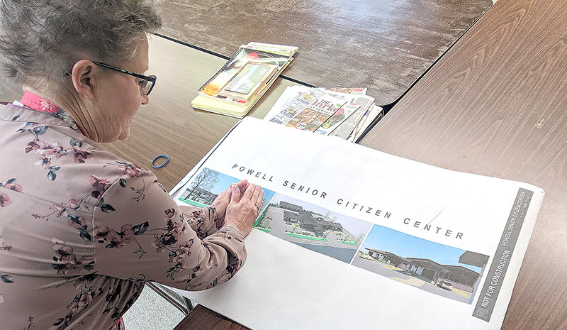 Powell Senior Center Director Linda Dalton looks over the plans for the new senior center. The project got a $1 million boost from Park County commissioners on Tuesday.