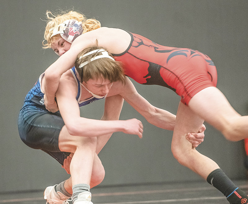 Powell’s Sam Loyning (left) tries to hold off a takedown attempt from Lovell’s Zayden Stahl during the Powell 3-Style USA Wrestling Tournament.