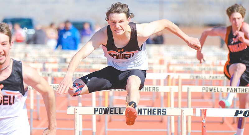 Simon Shoopman placed third in the 110-meter hurdles, just behind Hyrum Jeide (left), and walked away with a victory in the 300 hurdles on Saturday.