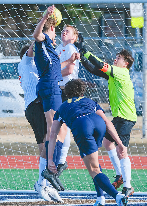 Colton Brewer, Jacob Orr (middle) and Holden Cooper scrambled early in the box against Cody. Powell kept the Broncs off the scoreboard before putting in two early goals to walk away with a 2-1 victory over their rivals.