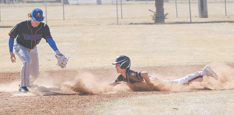 Ethan Welch dives into second base on a steal on Sunday. The Pioneers came up short against the ‘AA’ Sheridan Troopers on both ends of a doubleheader to open the season.