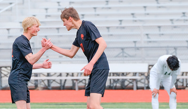 Chance Franks (left) and Rem DeVries celebrate after DeVries scored a goal against Pinedale on Saturday. The Panthers continue to lead the 3A West and are nearing a guaranteed place at state.