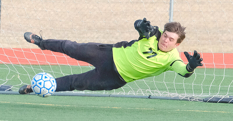 Holden Cooper dives for a save during a penalty shootout with Lander on Friday. The Panthers moved to 7-0 in the 3A West to set up a key matchup with Cody at home this week.