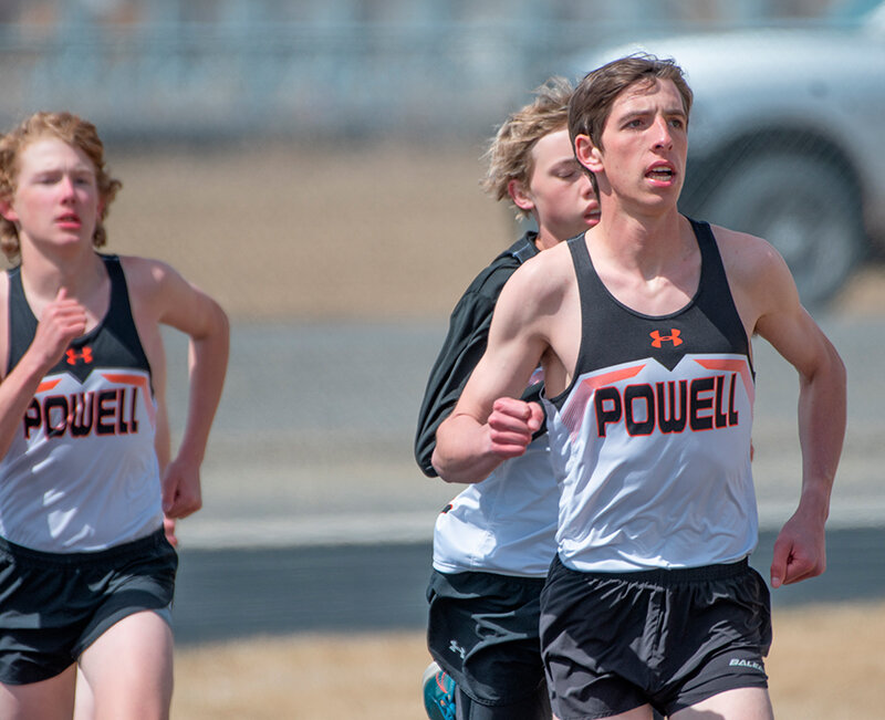 Daniel Merritt (right) ran away just ahead of Korbyn Warren (center) and Liam Taylor with the 800 and 1600 meter titles in Lovell on Saturday.