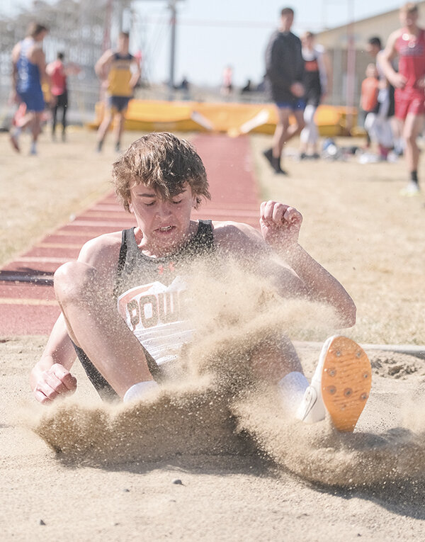Tevon Schultz kicks up sand during the long jump on Saturday. The Panthers had a strong week showcasing their talents at different venues around the state.