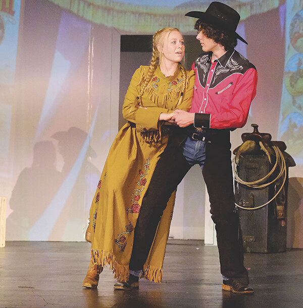 Powell High School student Hannah Sears (Annie Oakley) dances with Joe Bucher (Frank Butler).