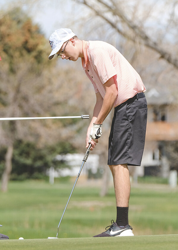 Andrew Jones sinks a putt during the spring Cody Invitational. The Panthers finished a strong spring in Lander before breaking off for the summer.