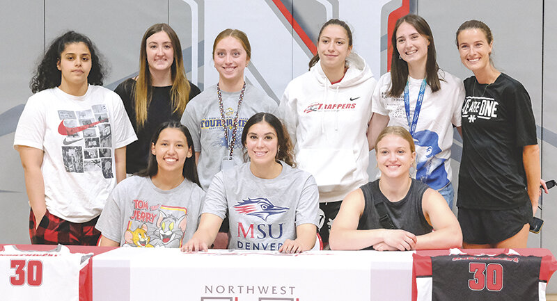 Hernandez is surrounded by her teammates and coach as she signed to Metropolitan State University of Denver. Back row from left: Batoul Khaleefah, Tyne Killip, Roxanne Rogers, Jimena Montoro-Cabezas, Yaiza Vacas-Lopez and Lauren Davis. Front row from left: Nayeli Acosta, Hernandez and Layla VonBerndt.