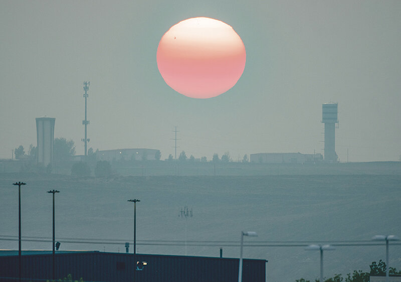 The setting sun is obscured by smoke Friday night during the Wyoming State Track Championships in Casper. A National Weather Service meteorologist in Riverton said we can start seeing relief from the smoke from Canada wildland fires starting this week.