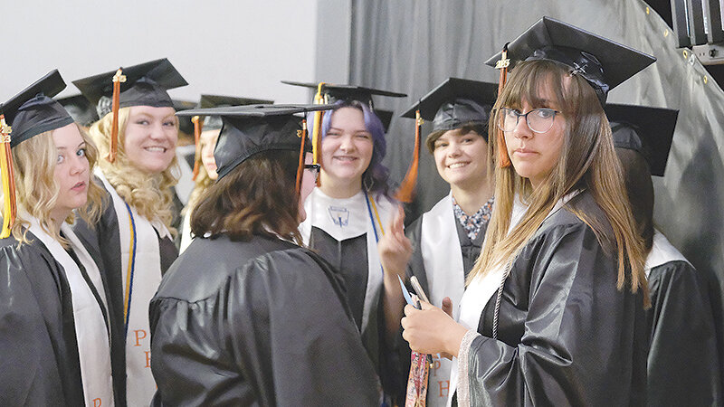 A group of Powell High School seniors chat before beginning their graduation ceremony on Sunday. From the left are, Jordyn Schuler, Shelby Fagan, Jade Ilg, McKenna Alley and Grace Coombs. In the center is Rhiannon Huhnke.