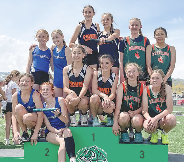 The seventh grade Cubs smile atop the podium after they won the 4x100 at the Best of the Best. Back row Autumn Kidd and Kindyle Floy, front row Addy Brown and Abigail Visocky.