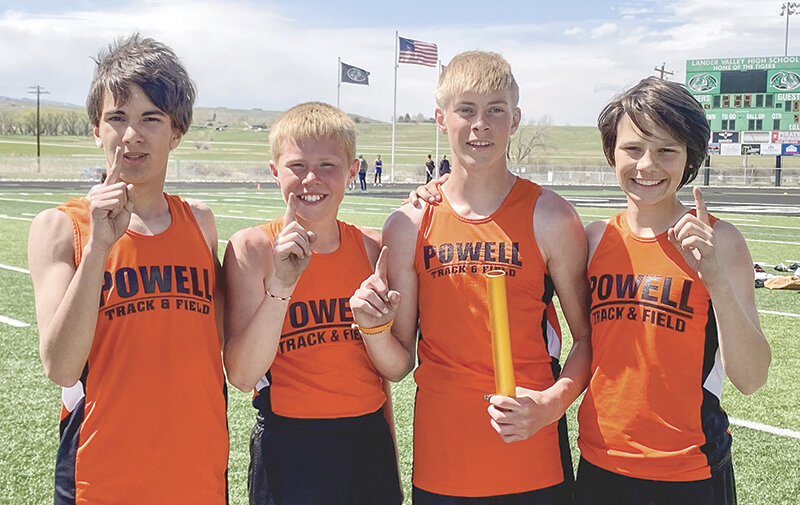 The seventh grade Cubs celebrate after setting the 800 sprint medley relay record at the Best of the Best. From left: Cobey Khan, Tucker Muecke, Keaton Bennett and Brayden Benander.