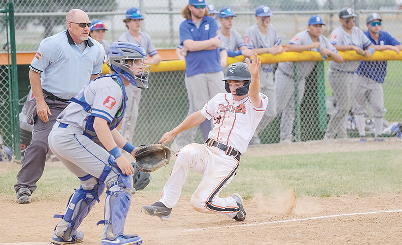 Dalton Worstell drops down to slide into home plate and beat the throw against Billings on Sunday. Powell had its seven game winning streak snapped against the Blue Jays.