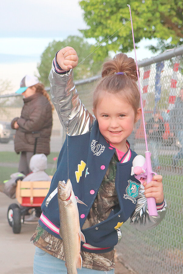 Lucy Edgell shows off her catch during a past Kids’ Fishing Day at Homesteader Park. The popular event returns to Powell’s fishing pond on Saturday, June 3.