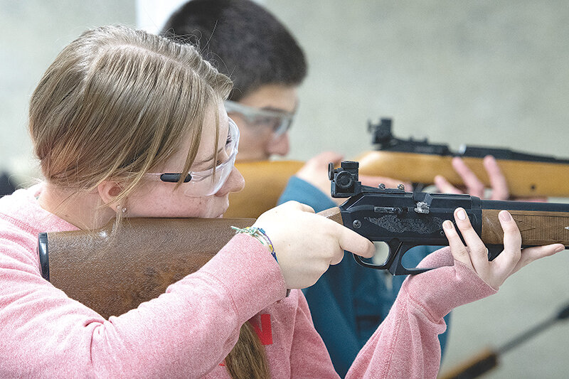 Maria Estes (front) and Philip Ellis compete in the air rifle competition during the Park County 4-H shooting competition at the Cody Shooting Complex last week. Estes won the Senior Class A Blue Face target archery competition and Ellis won the Senior Class B Blue Face archery and Class B 3D archery competitions.