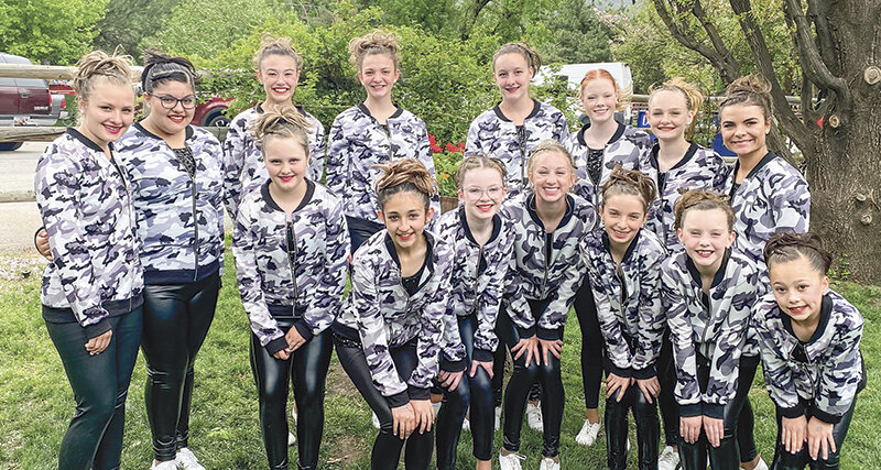 Competition team Absaroka Mountain Thunder Explosion poses for a photo. Back row from left, Jamie McKenna, Janicia Ramirez, Stella Shoopman, Sharae Shoopman, Bailee Allred, Emma Brence, Piper Bradish and Abby Wambeke. Front row from left, Lexi McKenna, Ella Rasmussen, Lucy Ostermiller, Karee Cooley, Hayden Hinojosa, Tenley Shorb and Kalia Wisniewski.