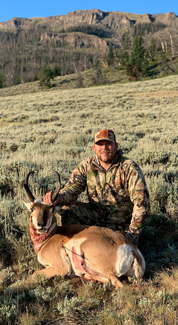 Local hunter Levi Kary shows off the first antelope he harvested with his bow.