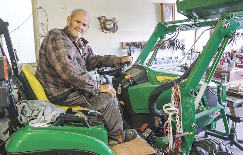 Norman Manweiler stays industrious despite his disability. After realizing he’d be responsible for plowing behind his house, he bought a tractor to do the job.