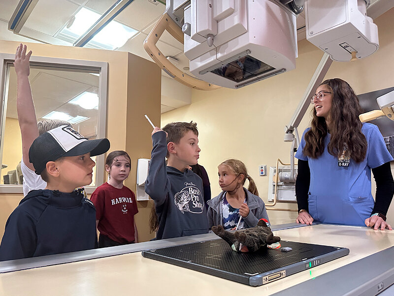 Sunset Elementary School students talk to hospital staff while visiting one of the departments.