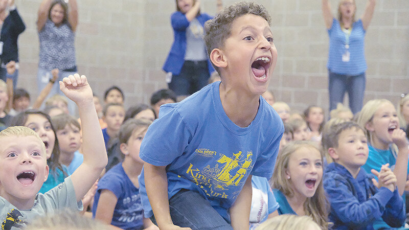 After learning that Southside Elementary School is a 2023 National Blue Ribbon School during an assembly on Tuesday, Brody Wiltshire (left) and Jonny Jackson could not contain their excitement.