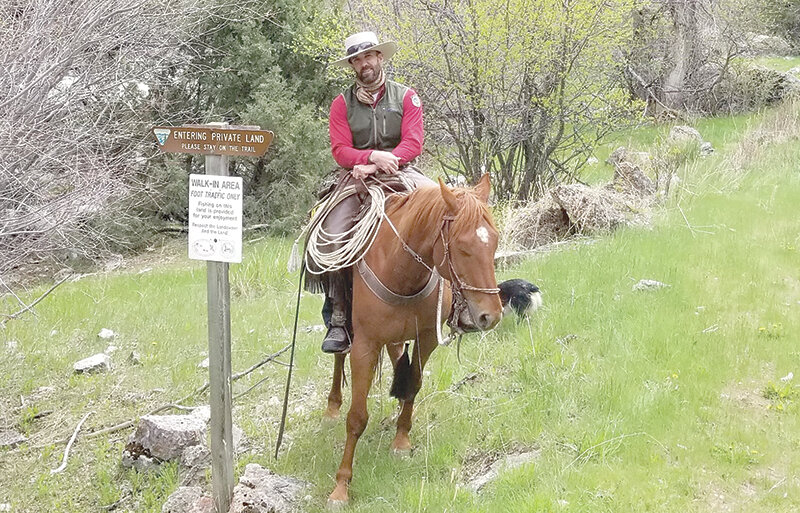 Game Warden Jordan Winter spends a lot of time in the backcountry in the saddle as part of his patrols in the Powell area.