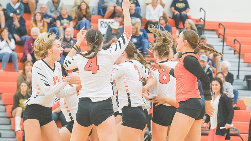 The Panther volleyball team celebrates in front of the home crowd Thursday night after defeating Cody for the first time in eight years.