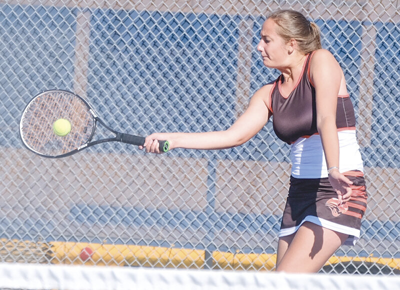 Powell No. 1 singles player Lachelle Lee hits a forehand during a match this week at the state tennis tournament in Gillette. Lee struggled with a pair of losses.