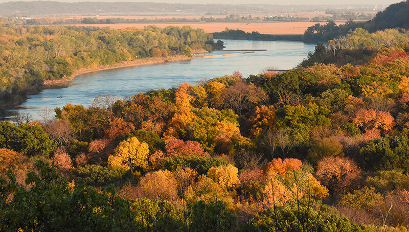 Were this picture color, one would see the fall colors in the spans of dense hardwoods on rolling hills and bluffs along the Missouri River between Nebraska and next-door neighbor Iowa.