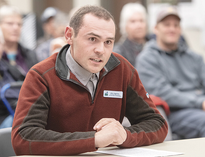 Powell’s Alex Aguirre, Wyoming Community Partnerships coordinator at Theodore Roosevelt Conservation Partnership, urges the board of land commissioners to delay a public auction of the Kelly Parcel while speaking at a public comment event in Cody on Tuesday.