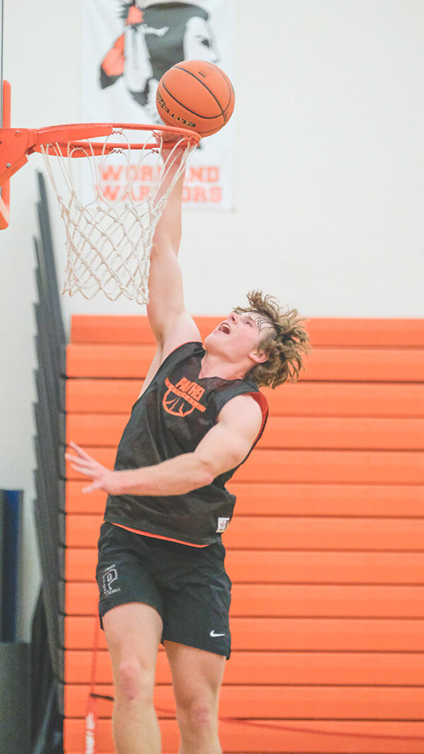 Senior Brock Johnson goes up for a dunk attempt during practice last week. The two time All-State selection will be one of six seniors to lead the Panthers this season.