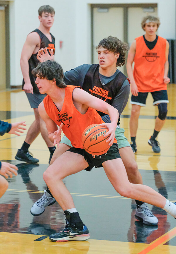 Sophomore Taeson Schultz drives into the lane against junior Keona Wisniewski during practice, with the Panthers having improved depth this season on the court.