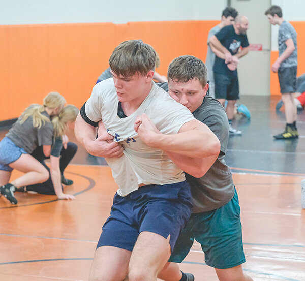 PHS senior Jimmy Dees (left) battles in a drill with junior Jacob Eaton during practice last week with the Panthers hoping for a stronger finish at state after an eighth place finish a year ago.