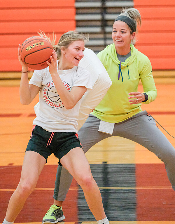 Coach Chelsea Kistler defends against senior Lauryn Bennett as the Panthers worked on post moves during practice last week.