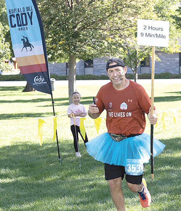 Holland poses in a tutu during the Buffalo Bill Half Marathon in September. He served as a pacer during the race.