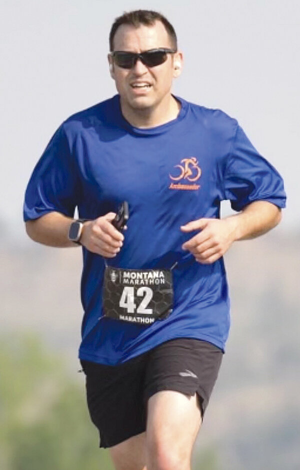 David Holland runs in the Montana Marathon in May after putting on weight following a knee surgery. He later shed the 25 pounds he gained.