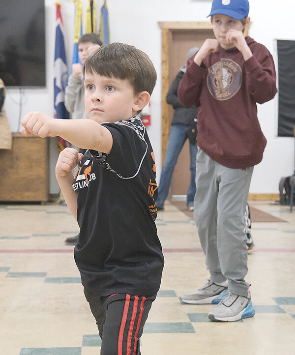 Weston Siggins (left) gives his undivided attention to a boxing drill, along with fellow boxer Toby Jordan.