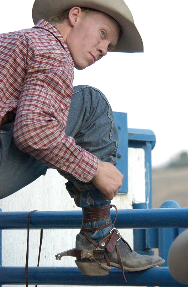 Cowboy Wade Sankey prepares for a rough stock ride in 2003.