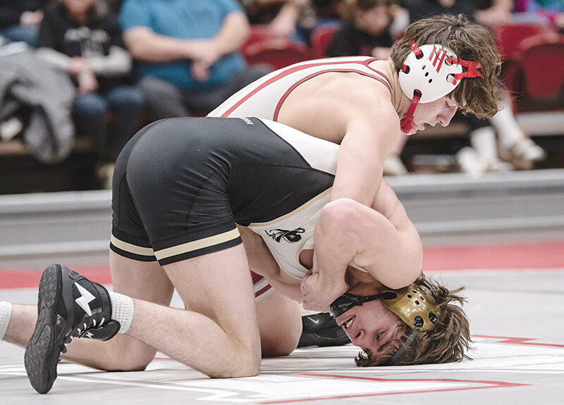 Treyson Davila (top) will continue his wrestling career at Arizona Christian University after spending two years as a Trapper.