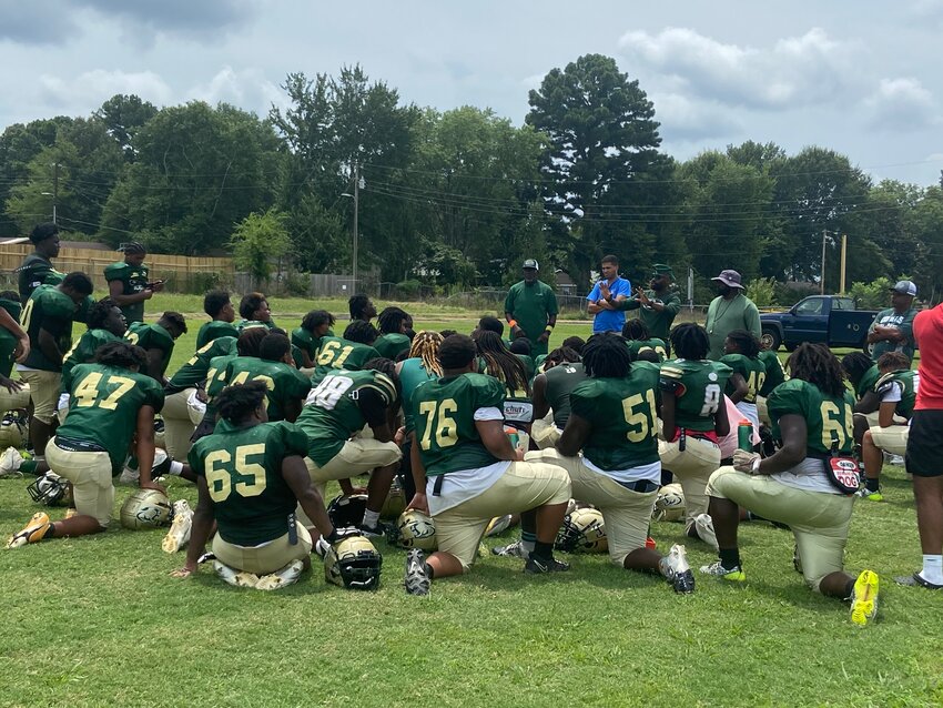 Jackson Central-Merry football coach Erit Turner wraps practice up with a team meeting on Wednesday, July 24, 2024, at the practice facility on Hollywood Drive.