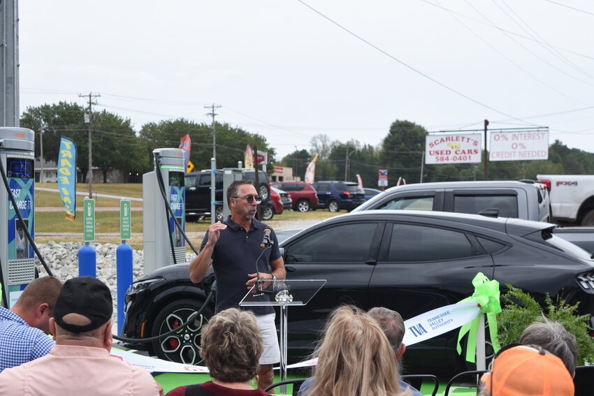 PROGRESS - Roy Dedmon, owner of Country and Western Steakhouse in Camden, which hosts the EV charging station, spoke to attendees about the restaurants commitment to pushing the limits of what is possible and striving to do what they can to improve the community.