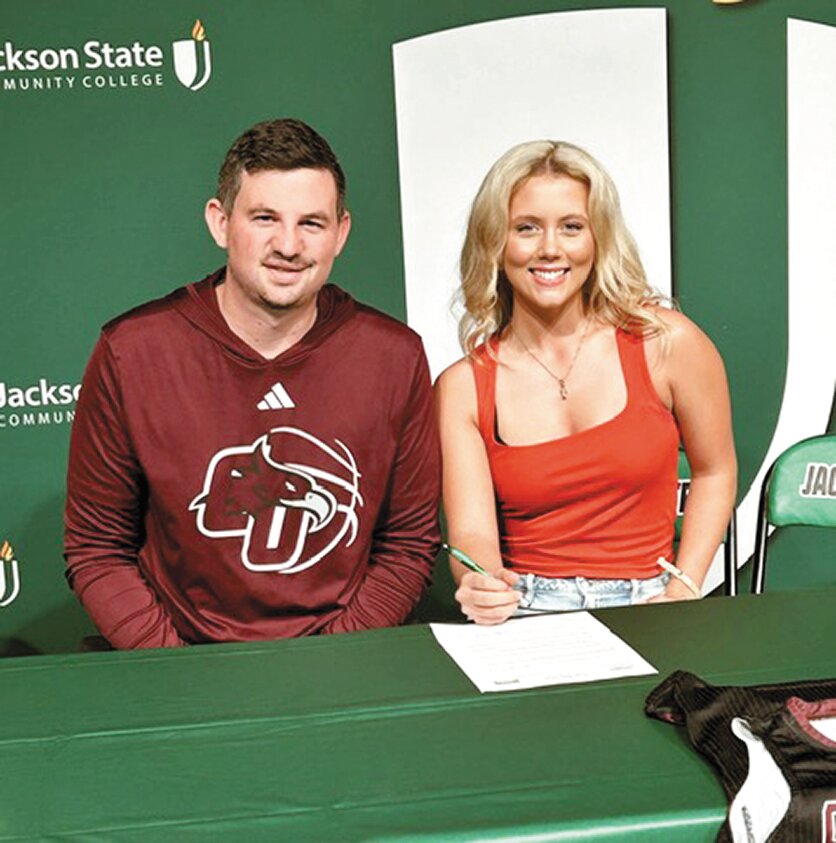 BASKETBALL SCHOLARSHIP - Head Coach Mark Vaughn has Bailey Morris sign scholarship papers to play women’s basketball at Cumberland University in the coming year.