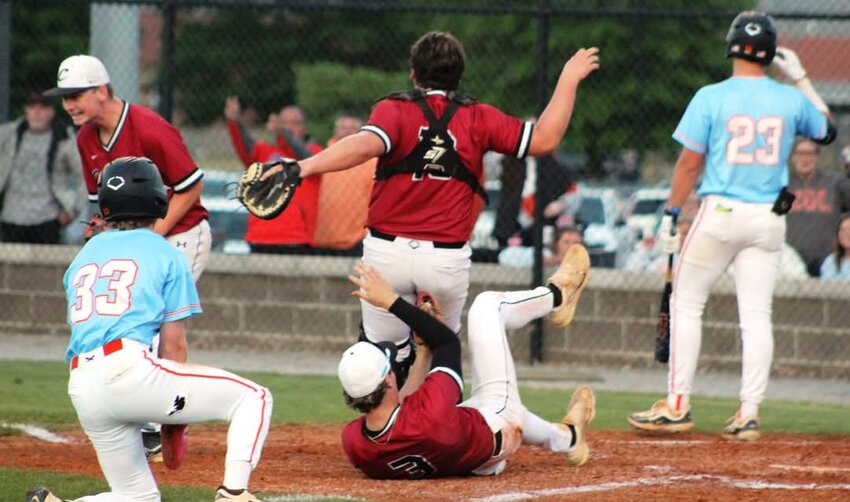 The craziest play in the game came when South Gibson’s Brock Beasley (33) tried to steal second. Catcher Carter Winders’ throw sailed off the glove off second baseman Aiden Austin and into centerfield, from where Callan Willis air-mailed a toss over third base to the fence. Beasley, trying to round third, may have gotten tangled up with the base umpire and tripped, but ended up in a rundown before Crockett’s Preston Lambert (3) tagged him out and then fell down behind Winders -- whom he appears to be tagging out in this picture. If you’re scoring at home, it was probably 2-4-8-5-2-5 (with maybe a “U” in there somewhere). (Photo by Ron Barry)