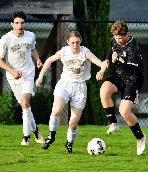 #16 Jayden Franks and #6 Ixaya Gonzales double-team a Mustang.