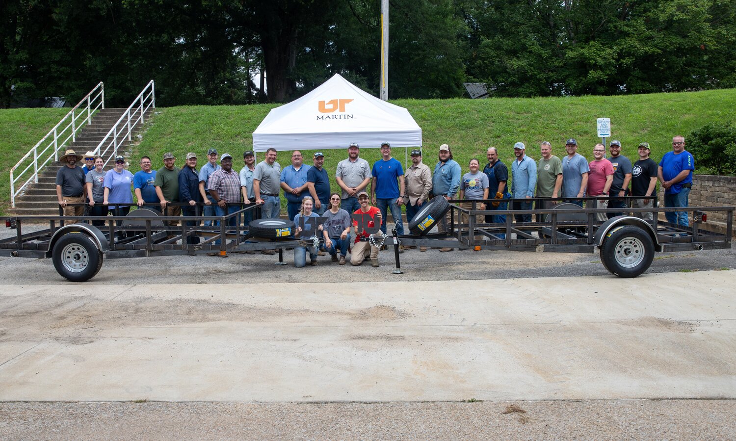 WORKSHOP 2 – High school agriculture teachers and workshop instructors posed for a group photo with two trailers that were built at the inaugural UTM trailer fabrication workshop. UT Martin will co-host a similar workshop next year at Murray State University.